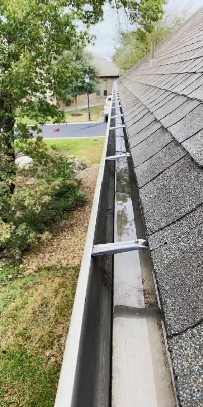 The same gutter clean and flowing after Somerville Roofing's visit